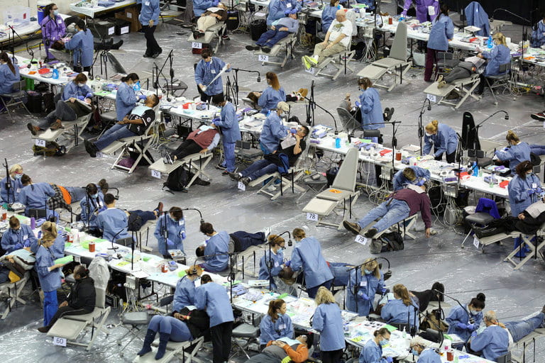 People received free dental work last month during the Seattle/King County Clinic, a four-day event that also offered free vision care and other health services. Credit David Ryder/Reuters