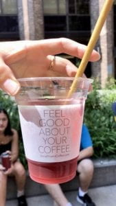 Think Coffee's "Feel Good About Your Coffee" cup with paper straw