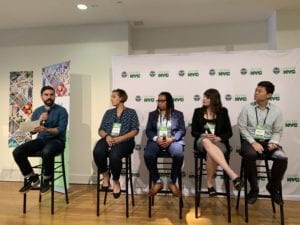 5 people sitting on stools as part of a speaker panel