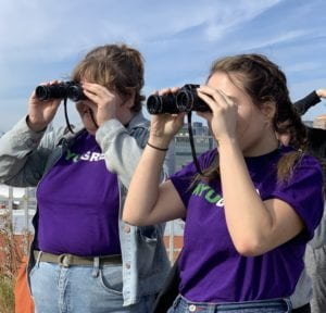 Carson and Tess looking out of binoculars