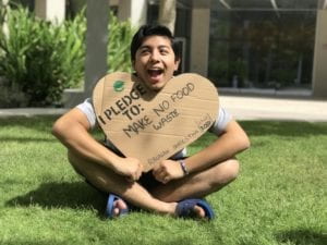 Raunak holding sign