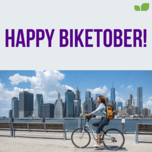 Person biking in front of New York City skyline. Title saying "Happy Biketober!"