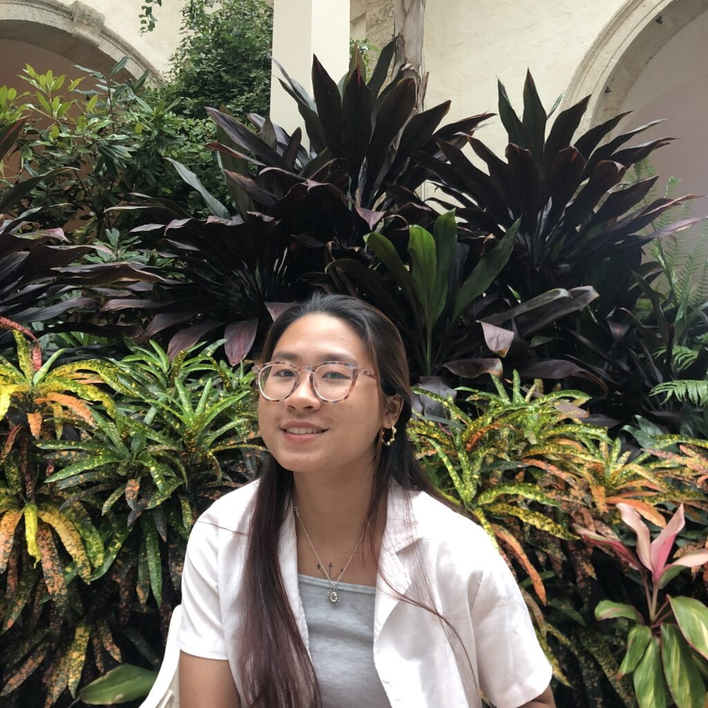 photo of person in front of plants