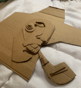 stacked layers of cardboard to recreate abstract self portrait of Dali. 