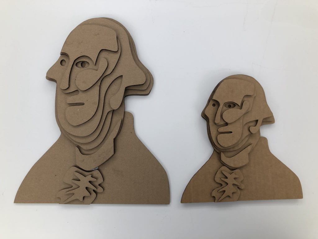 Cardboard 3/4 profile tactile graphics. Left graphic is exaggerated in the neck. Right graphic is true to form of the original painting of George Washington.. 