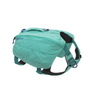 Jessica’s teal saddle bag for Chewie. A side profile is shown where the zipper opens horizontally like a fanny pack.