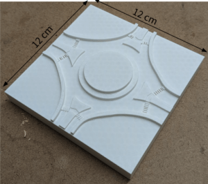 A white 3D-printed roundabout model 12cm by 12 cm.