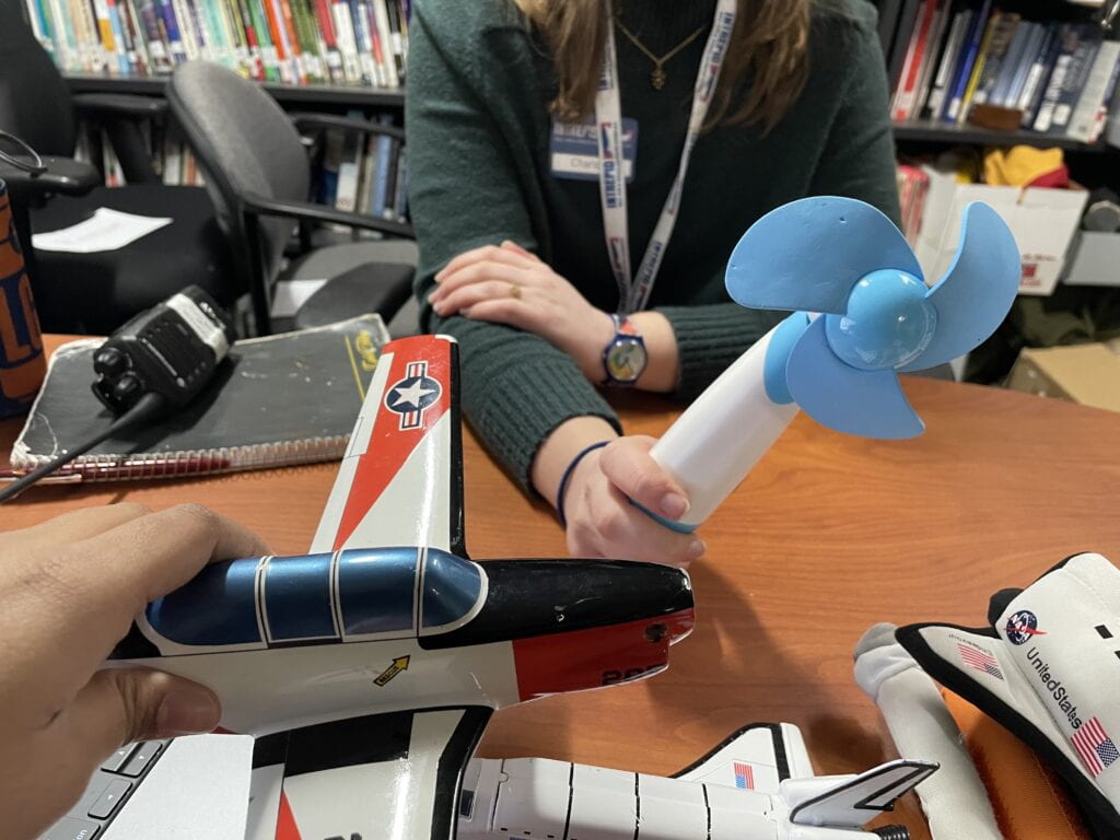 Model airplane and handheld fan