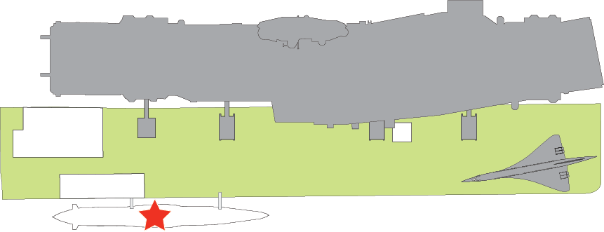 Floor plan of Pier 86. A red star marks the center of the Submarine Growler. When you exit the Welcome Center, the Submarine Growler is on the right side of the pier. To enter the submarine, go through the exhibit, A View From the Deep: The Submarine Growler and the Cold War, in the tent that is between the submarine and the Welcome Center. 