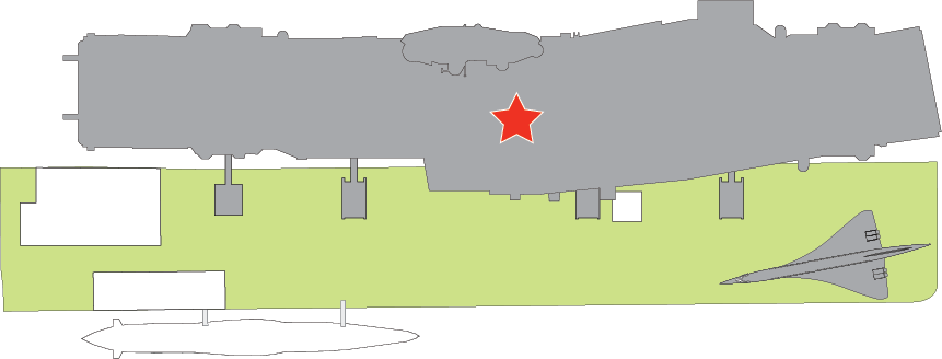 Floor plan of Pier 86. A red star marks the center of Intrepid. When you exit the Welcome Center, Intrepid is the full length of the pier on your left. To enter the ship, go straight ahead to the staircase and elevator at Tower 1.