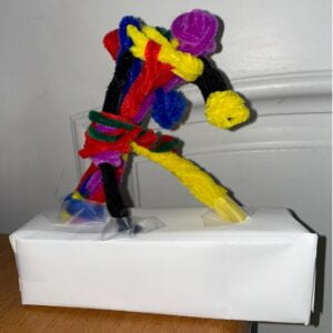 An abstract pipe cleaner sculpture of a clown.