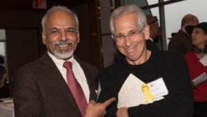 Dean Katepalli Sreenivasan smiling and pointing at Senior Lecturer Allan Goldstein at Martin Luther King, Jr. Faculty Awards