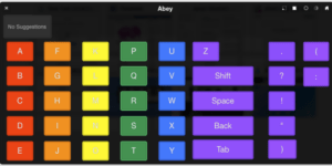 Touchscreen keyboard displays keys in alphabetical order, divides each column of keys by color-coding.