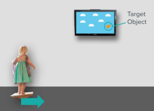 Child standing on balancing board near a screen displaying a target object.