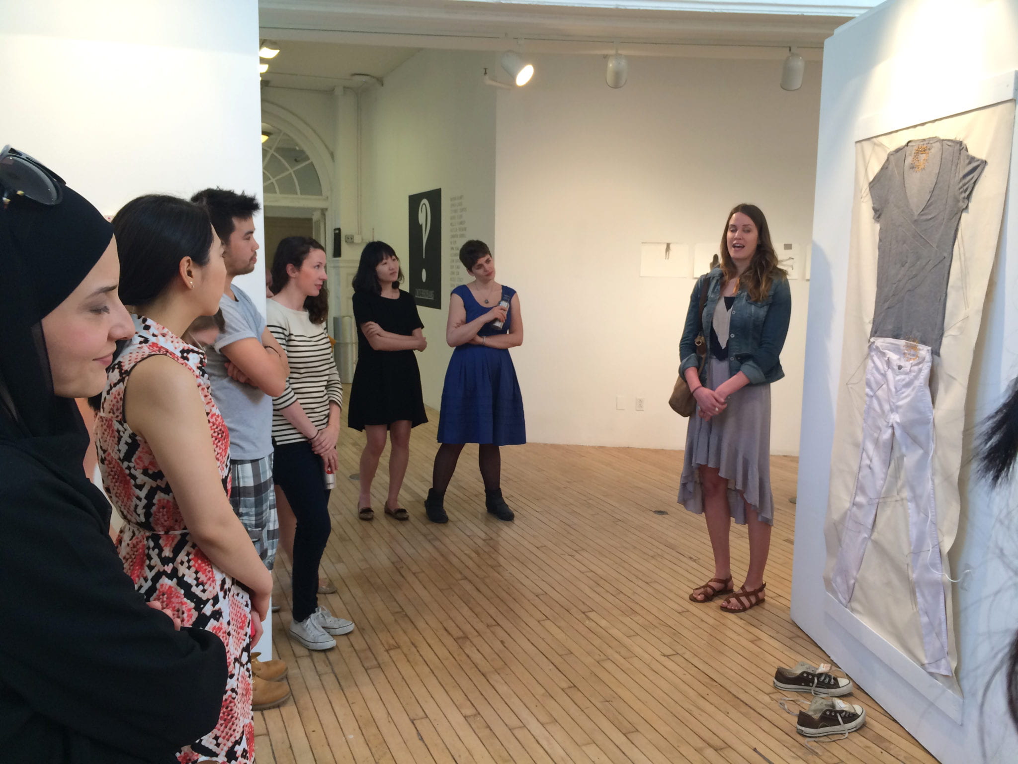 Graduate students at the Interrobang exhibition. 