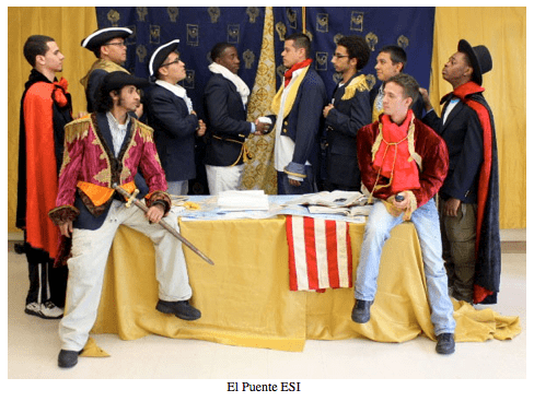 Students dressed up and posing, titled, "El Puente ESI."