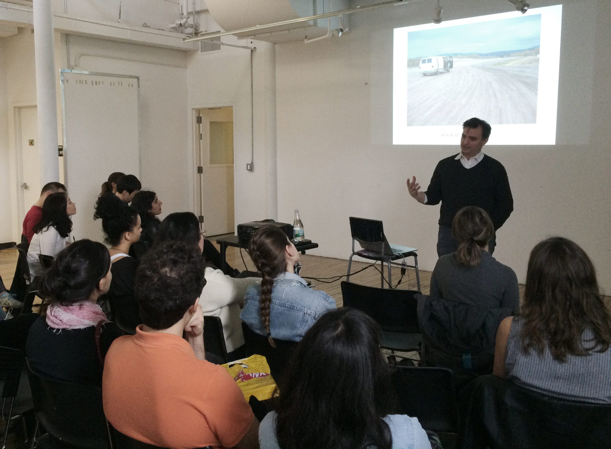 Pablo Helguera presenting to a group of graduate students. 