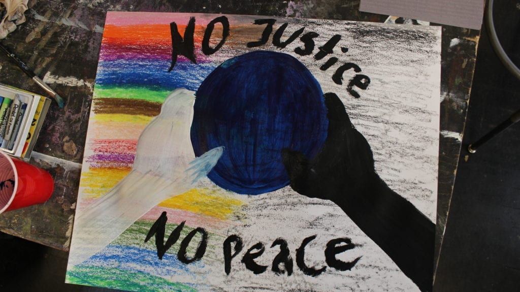 Student artwork that reads, "No Justice No Peace."