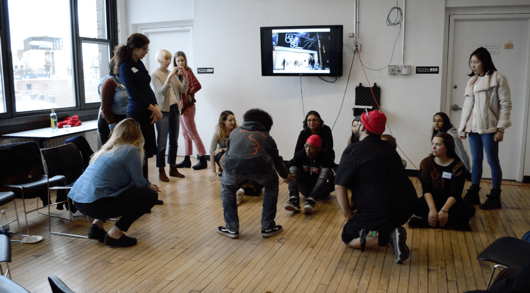 Group participating in a workshop led by Shaun Leonardo. 