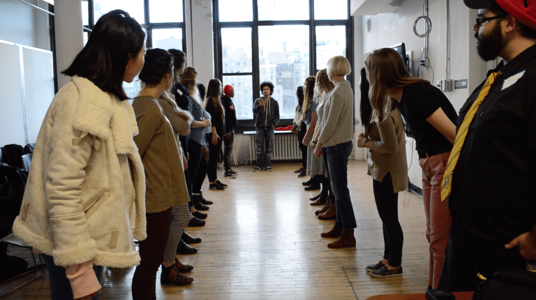 Group participating in a workshop led by Shaun Leonardo.