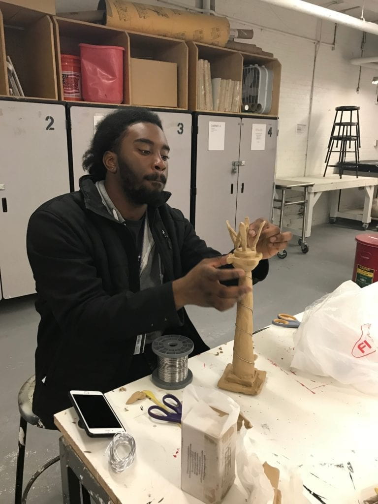 Student working on a sculpture during a Visionary Studio session, 2018