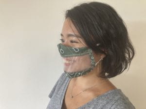 This fabric mask has a clear window that allows others to see a user’s mouse and read lip movement. The size of clear window is 6cm by 20cm and the fabric color is green with white ear bands.