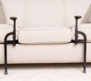 An item with two legs and two handles  is fixed between cushion seat and cushion base