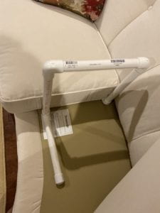 Grab bar beneath the cushion