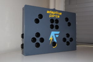 Completed adaptive force box with blue and yellow logo on a white table