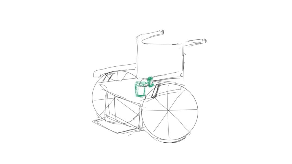 Prototype 2.1 - a wheelchair with the cupholder attached using a clamp