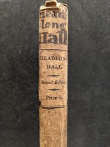 Detail of book spine with handwritten text.