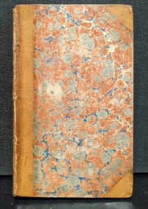 Front cover of book showing marbled paper cover.