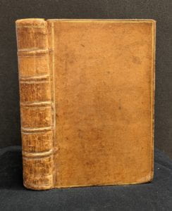 Front cover and spine of leather book.