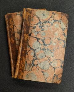 Front covers of books showing marbled paper cover.