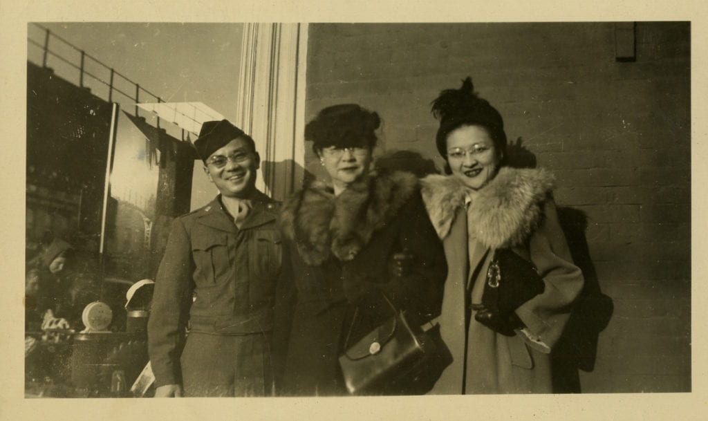 Photograph of New York City, Dec. 1946. Peter Hata, left (Midori's husband), Shizue Shimanochi, middle, (mother), Mari (Midori's sister)