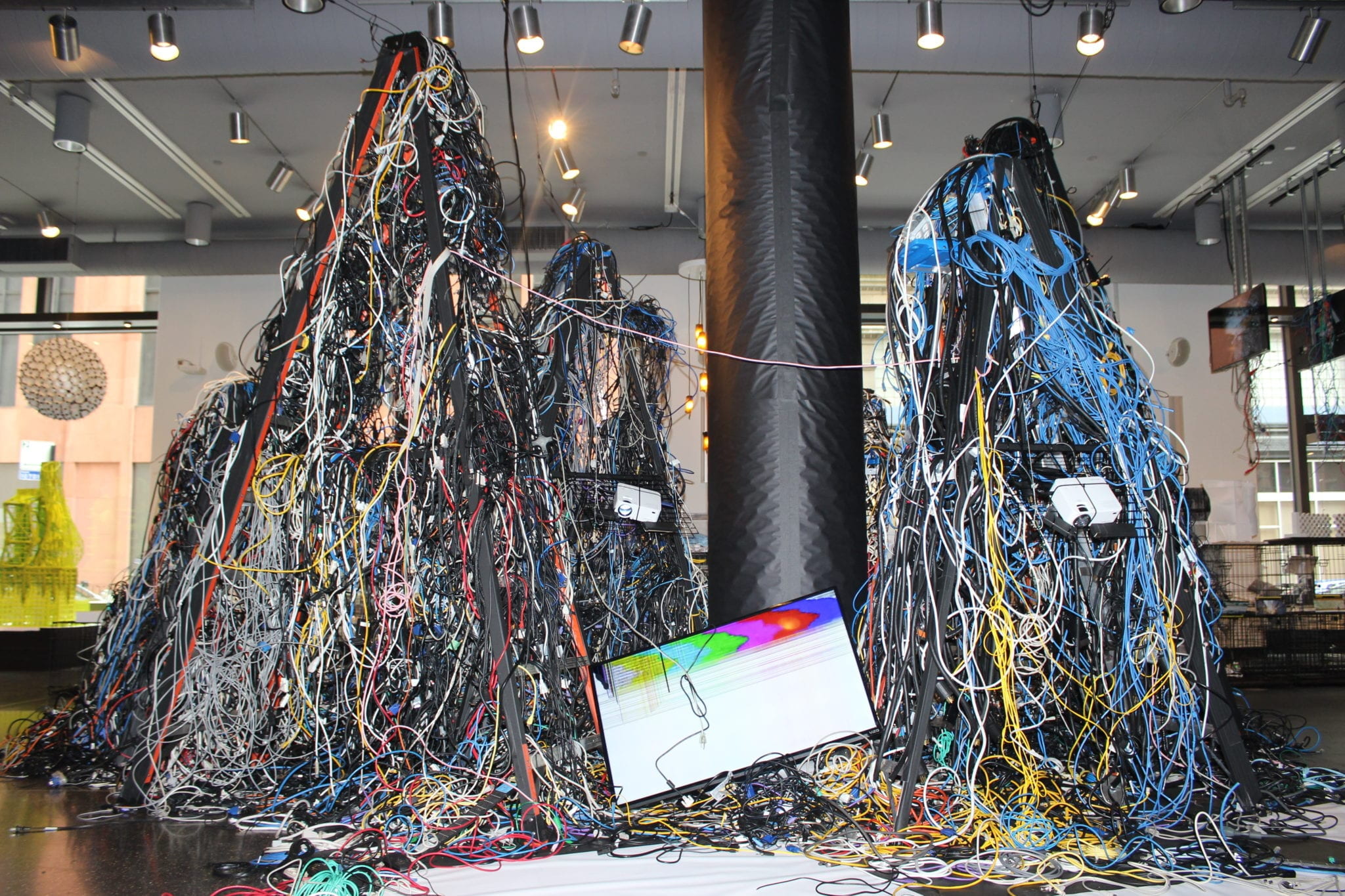 Sculpture made out of wires and a broken TV screen