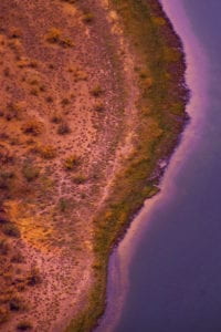 Photograph of a body of water alongside a shoreline