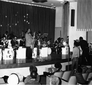 Black and white image of band on stage