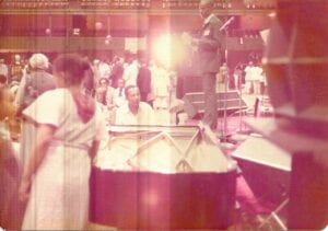 red tinted vintage photo of band on stage