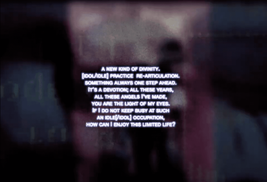 Still image from video that has a blurry black background with text on top.