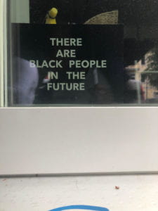 Sign that reads: THERE ARE BLACK PEOPLE IN THE FUTURE.