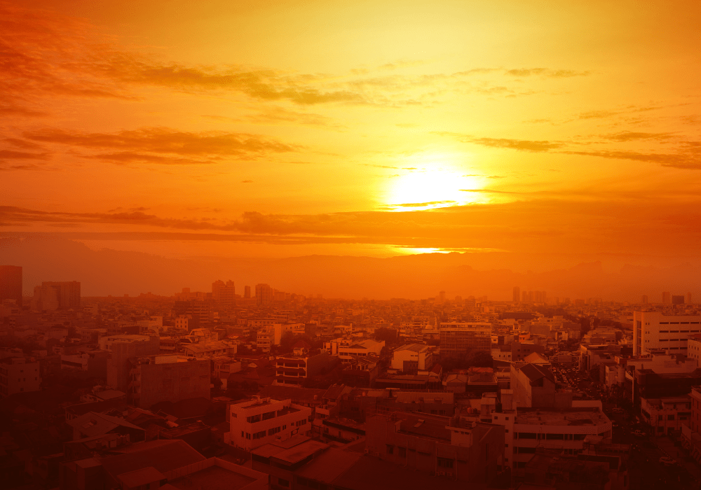 Sun shining above city