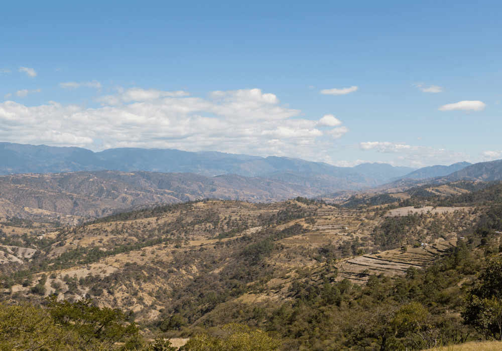 Mountains and hills on the road to Quiche in Guatemala - mountains with few trees - environmental deforestation.