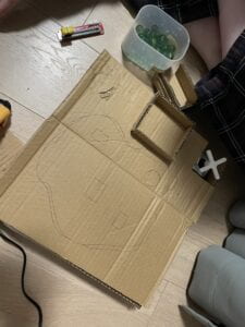 Carboard box with outline of pond