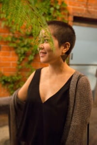 Author standing behind leaf fronds