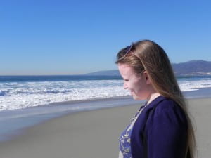 Sarah Smith at beach looking out at water