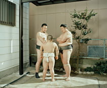 Men in traditional Japanese loincloths standing in circle