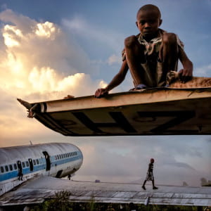 children playing on abandoned airplanes