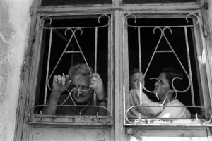 People looking through decorated windows