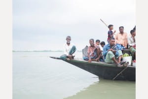 Many people on a simple boat 